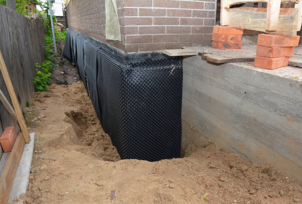 SJ Waterproofing Pros technician performing targeted Basement Waterproofing assessment in Allenton, WI